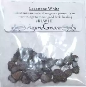 Single white lodestone — a natural pale magnetic stone shown with visible magnetic properties for hoodoo spiritual attraction and conjure ritual use.