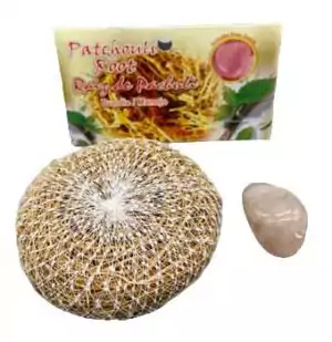 Patchouli root herb bundled with rose quartz crystal for a love and grounding ritual kit