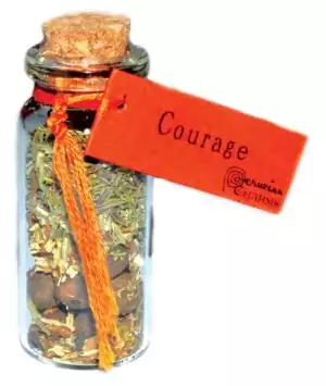 Small corked glass courage pocket spellbottle with Mars-ruled herbs and crystals for bravery and bold action ritual charm