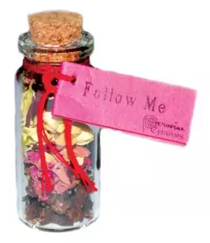 Small corked glass follow me pocket spellbottle with herbs for hoodoo commanding and drawing ritual charm for attraction magic