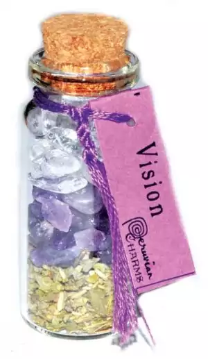 Small corked glass vision pocket spellbottle filled with herbs and crystals for psychic sight and third eye ritual charm