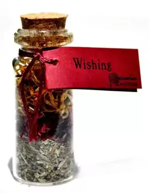Small wishing pocket spellbottle with ritual components sealed inside, a portable manifestation charm for intention-setting and wishing magic workings.