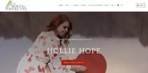 Woman in a floral dress holding a large red heart while smiling outdoors — illustrating a warm, welcoming practitioner website service.
