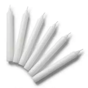 Six white tapered household candles arranged in a row with pointed ends, set of 6 versatile white ritual candles for altar and spiritual ceremony use
