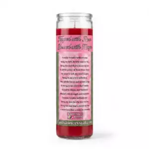 A tall, red candle in a glass holder with a decorative label featuring text and floral designs. The label includes instructions or messages related to the candle's use.