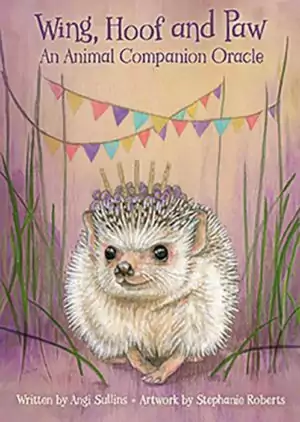 Whimsical illustration of a hedgehog with crown of lavender surrounded by colorful bunting on the Wing Hoof and Paw animal oracle deck card