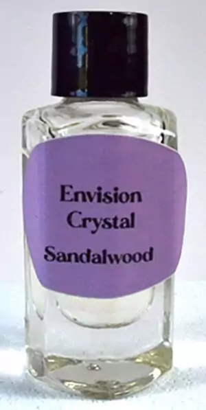 Small 2-dram bottle of Envision Crystal sandalwood ritual anointing oil for meditation, altar consecration, and devotional sacred work.