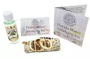 Florida Water ritual kit showing a Florida Water bottle, white sage herb bundle, and printed instructional cards for spiritual cleansing.