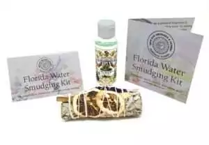 Florida Water smudge kit with a sage bundle, small Florida Water bottle, and instructional cards arranged neatly on a white background.
