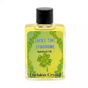 Small 4 dram yellow-tinted glass bottle labeled Lucky Girl Syndrome spiritual oil with clover graphic and Envision Crystal branding.