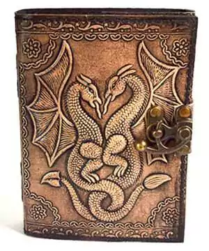 Aged leather-look journal with embossed double dragon design and decorative knotwork on the cover, secured with a metal clasp latch.