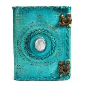 Turquoise blue leather-bound journal with embossed decorative design and embedded stone accent with metal latch closure