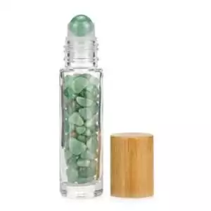Glass roller bottle filled with small green aventurine gemstones and bamboo cap with rounded green stone on top, 10ml oil roller for luck and heart healing