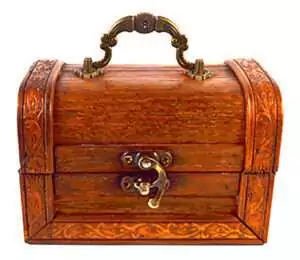 Small intricately carved hinged wooden chest with brass handle and latch — decorative carved patterns along the edges of this antique-finish storage box.
