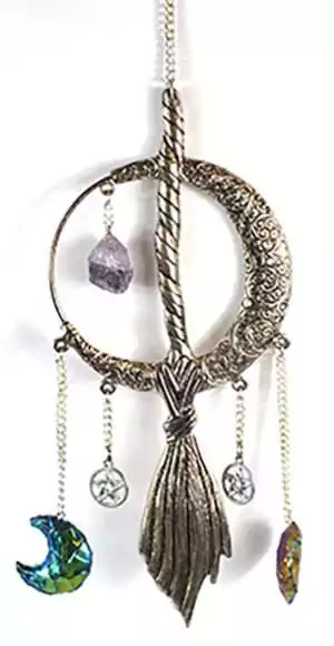 12 inch pewter crescent moon and broom wall hanging showing cast metal witch broom and moon decoration for altar and sacred space walls