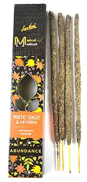 Artisanal incense sticks labeled White Sage and Myrrh with a decorative box featuring colorful botanical illustrations from SreeVani Magical Manifest.