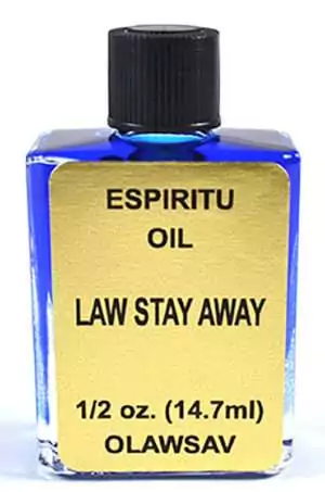Small blue bottle of Espiritu Law Stay Away ritual fragrance oil 4 dram, for hoodoo court case protection and legal trouble avoidance ritual work.