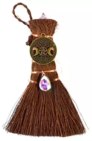 6-inch mini altar besom broom with natural fibers, bronze crescent moon pendant, and hanging amethyst crystal for Wiccan triple moon ritual decoration.