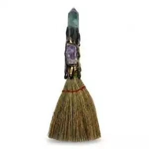 7-inch amethyst and fluorite crystal broom altar tool with colorful crystal-adorned handle and dark bristles, used for ritual cleansing and witchcraft practice.