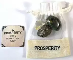 Prosperity Crystal Kit showing citrine, nephrite jade, and pyrite stones together — three abundance crystals for wealth manifestation and good fortune.