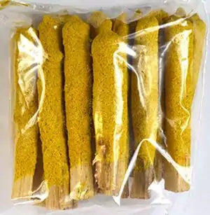 Package of yellow cinnamon dipped palo santo sticks in natural material, neatly arranged and sealed in transparent packaging.