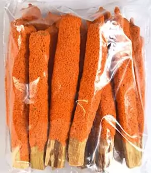 Set of 25 sun kissed palo santo dip sticks in warm orange tones, packaged tightly together for ritual cleansing and solar energy smudging.