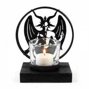 Alchemy Gothic Baphomet tealight holder with a lit glass candle and black metal winged Baphomet figure backdrop for occult altar candle display.