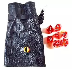 Red polyhedral gaming dice in various shapes alongside a black textured eye-design bag with drawstring, for RPG and tabletop dragon-themed gaming.