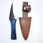 Arrowhead athame ritual dagger 6.5 inches with shiny blade and decorative handle, shown alongside its fitted leather sheath for Wiccan altar use.