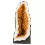 Large 69.4 lb citrine cathedral quartz geode with vibrant orange and golden-yellow crystal interior points rising from natural rock exterior, collector-grade abundance specimen.