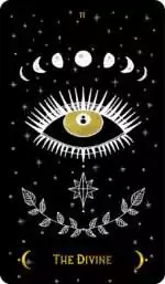 Macabre Tarot_Cards-II Macabre Tarot The Divine card featuring a central eye surrounded by moon phases and star motifs against a stark black background.