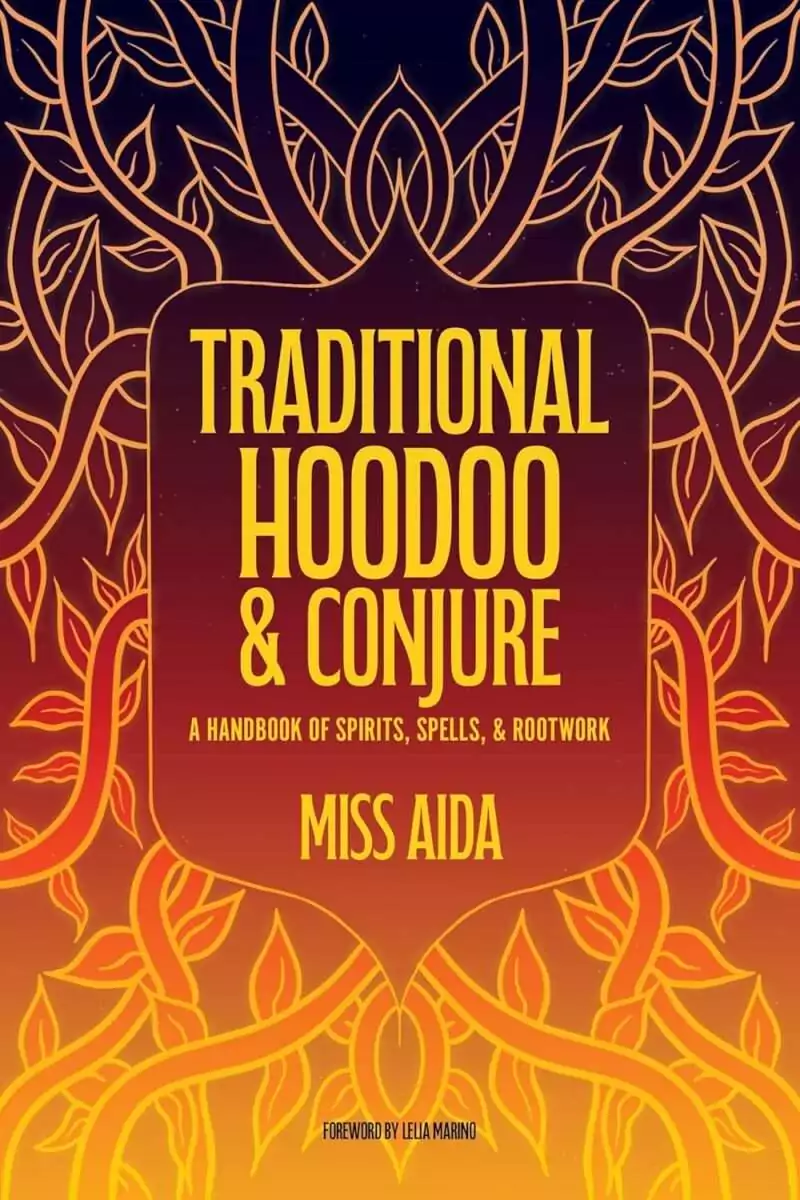 Traditional Hoodoo and Conjure book cover by Miss Aida with vibrant decorative artwork and bold title lettering