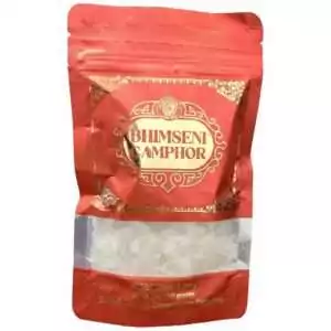 Red packaging of Bhimseni camphor chunks featuring traditional Indian decorative label for spiritual cleansing and aromatherapy
