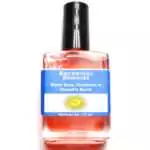 White Sage Patchouli Dragon's Blood Escential Essences oil ½ oz roll-on by Auric Blends — glass bottle with dark botanical label.