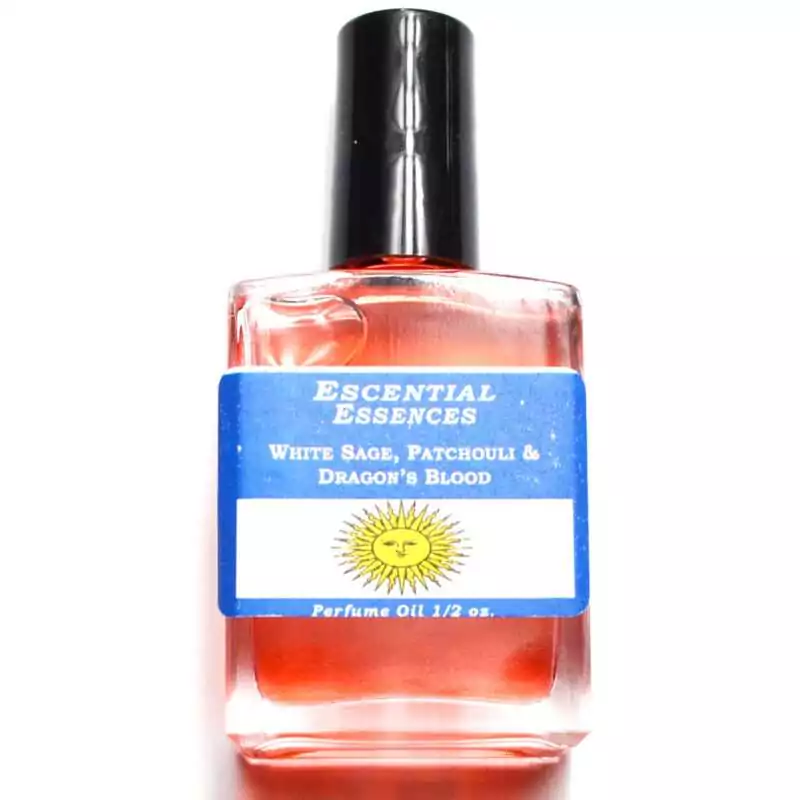 White Sage Patchouli Dragon's Blood Escential Essences oil ½ oz roll-on by Auric Blends — glass bottle with dark botanical label.