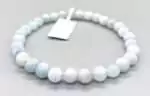 Aquamarine crystal bracelet with 4mm natural beryl beads in pale sea-blue — March birthstone jewelry on white background.