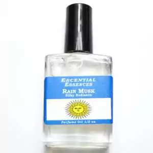 Rain Musk fragrance oil half oz β clear glass bottle with blue and white label featuring sun graphic, Escential Essences Rain Musk 0.5 oz perfume oil.