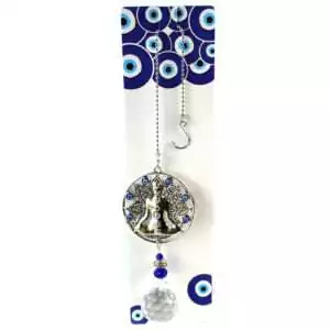 Wall hanging measuring 13.25 inches with a Buddha charm and hanging faceted crystal prisms that cast rainbow light, shown against plain background