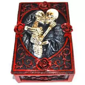 Rectangular 3.5 by 5.25 inch hinged resin box with full skeleton relief sculpted on the lid, dark aged finish, shown on plain background