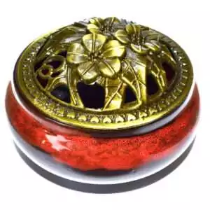 3.75-inch ceramic cone incense burner with red and black lava-flow glaze pattern, cone holder recess visible on top surface