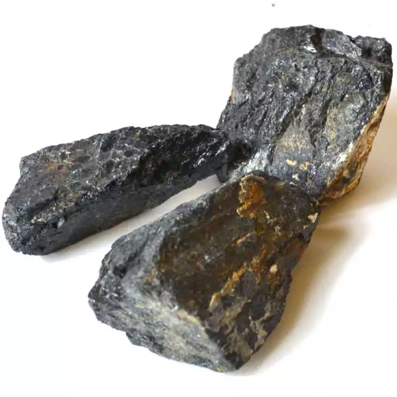 3-lb-Black-Tourmaline-untumbled-stones-GUTOUB3 Three pounds of raw untumbled black tourmaline schorl stones in a pile showing striated black mineral surfaces and prismatic crystal structure in varied chunk sizes