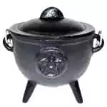 4.5-inch black cast iron cauldron with embossed pentagram star on the side, three legs and curved handles, shown on plain background
