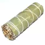 4 inch white sage and eucalyptus smudge stick wrapped with natural twine, showing green eucalyptus leaves alongside white sage
