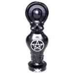 A 5.5-inch black goddess figure candle molded in the silhouette of a standing female form, solid black wax with smooth finish on a plain background