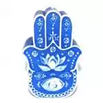 A 5.5-inch blue wax figure candle molded in the shape of the Hand of Fatima (Hamsa), showing a detailed hand silhouette in deep blue with a smooth wax finish