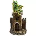 Resin 5.5-inch dragon perched on a castle tower figurine with illuminated LED light base glowing through the sculpture in warm light
