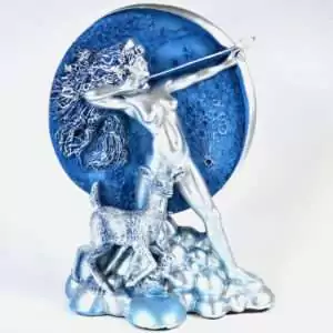 7.25 inch resin statue of Diana the Roman moon goddess holding a bow, with crescent moon motif, on a plain background