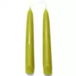 A pair of 7-inch melon green taper candles upright, displaying a warm soft green color with smooth wax and tapered pointed ends