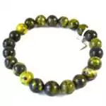 Eight millimeter green serpentine beaded stretch bracelet with mottled olive and dark green natural stone pattern on a white surface