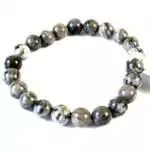 Eight millimeter map stone jasper beaded stretch bracelet with earthy tan, brown, and green landscape-patterned beads on a white background